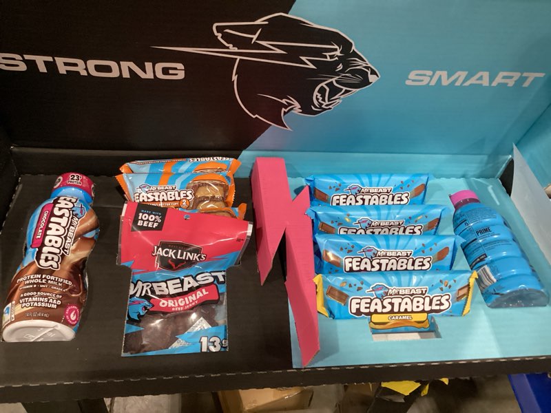 Condition photo showing New/Like New for feastables beast games season 2 snack bundle, 10 count, mrbeast chocolate bars & cups, protein milk, hydration drink & beef jerky