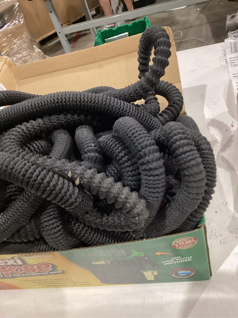 Condition photo showing As Is for flexi hose expandable garden hose with 8 function nozzle, 75ft - lightweight retractable garden hose, water hose - no-kink flexibility, 3/4 inch solid brass fittings and double latex core 75ft black