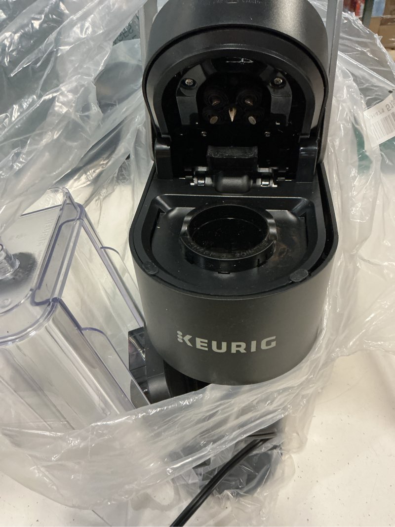 Condition photo showing As Is for keurig k-slim single serve k-cup pod coffee maker, multistream technology, 3 brew sizes, slim and sleek design, 46oz removable reservoir, black