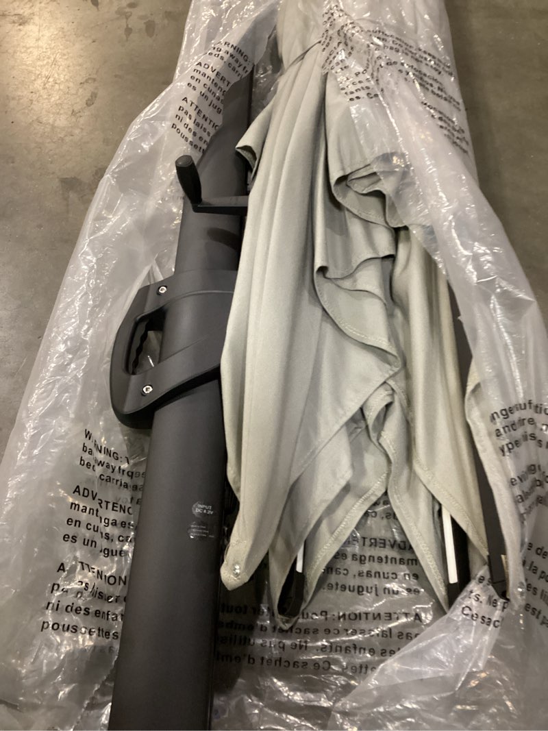 Condition photo showing As Is for mondawe 10-ft aluminum gray no-tilt cantilever patio umbrella with base