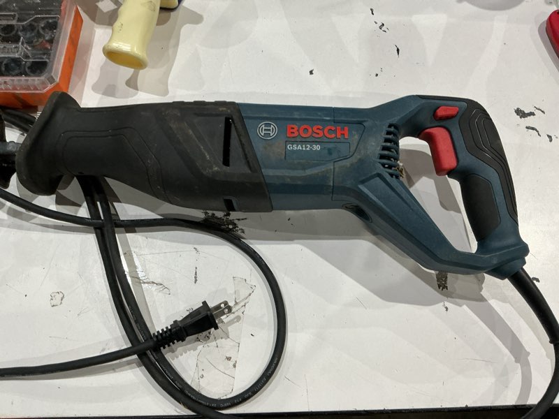 Condition photo showing As Is for bosch 12 -amp variable speed reciprocating saw ( charger not included )