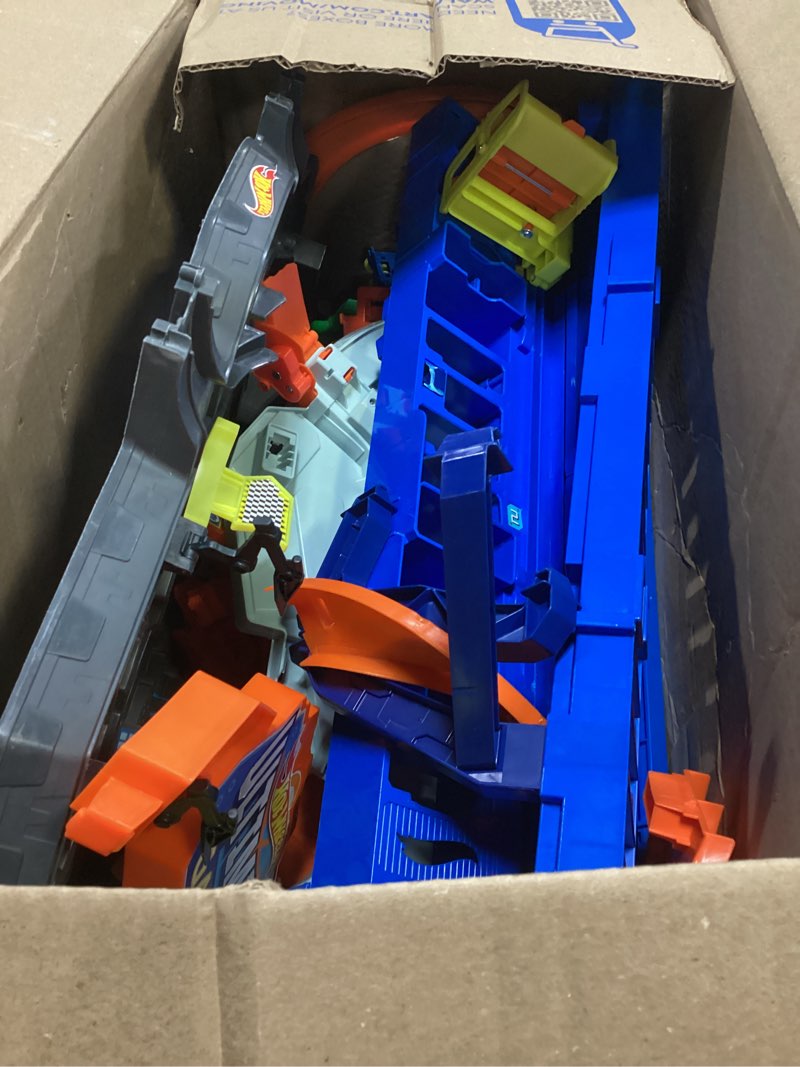 Condition photo showing As Is for hot wheels toy car track set, hw ultimate garage playset with 2 1:64 scale vehicles & t-rex dinosaur, multiple levels for racing, stunting & storage ????
