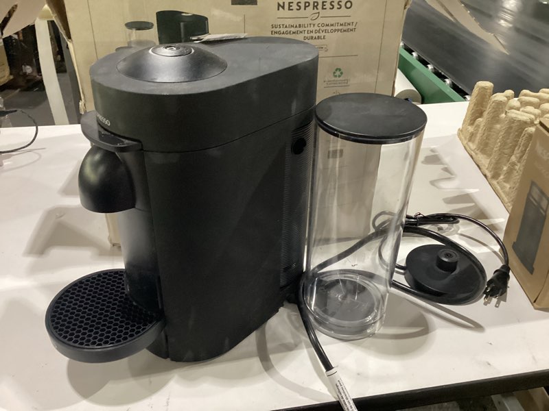 Condition photo showing As Is for damaged nespresso vertuo plus deluxe coffee and espresso maker by de'longhi, matte black with aeroccino milk frother machine + frother black matte