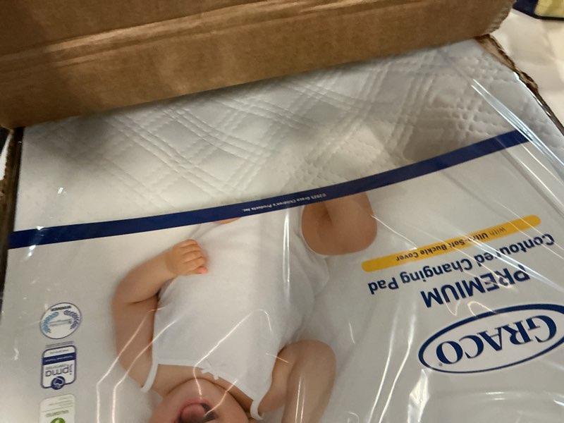 Condition photo showing Good Condition for Graco Premium Contoured Changing Pad – GREENGUARD Gold Certified, Water-Resistant, Ultra-Soft Buckle Cover, Contoured Baby Changing Pad, Fits Most Standard-Size Changing Toppers, Non-Skid Bottom