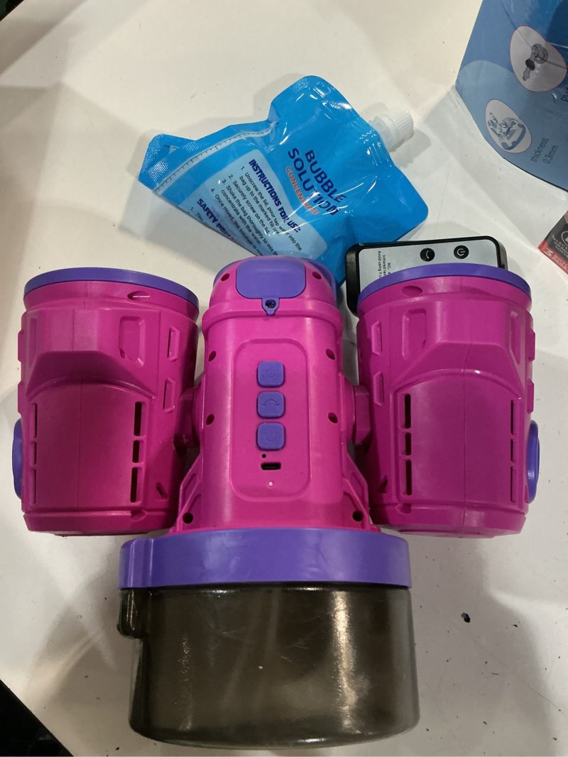 Condition photo showing As Is for dual-engine bubble machine with auto rotation & rgb lights & remote control,1800ma type-c rechargeable,700ml tank,bubble maker for kids, party, wedding, backyard outdoor toy purple