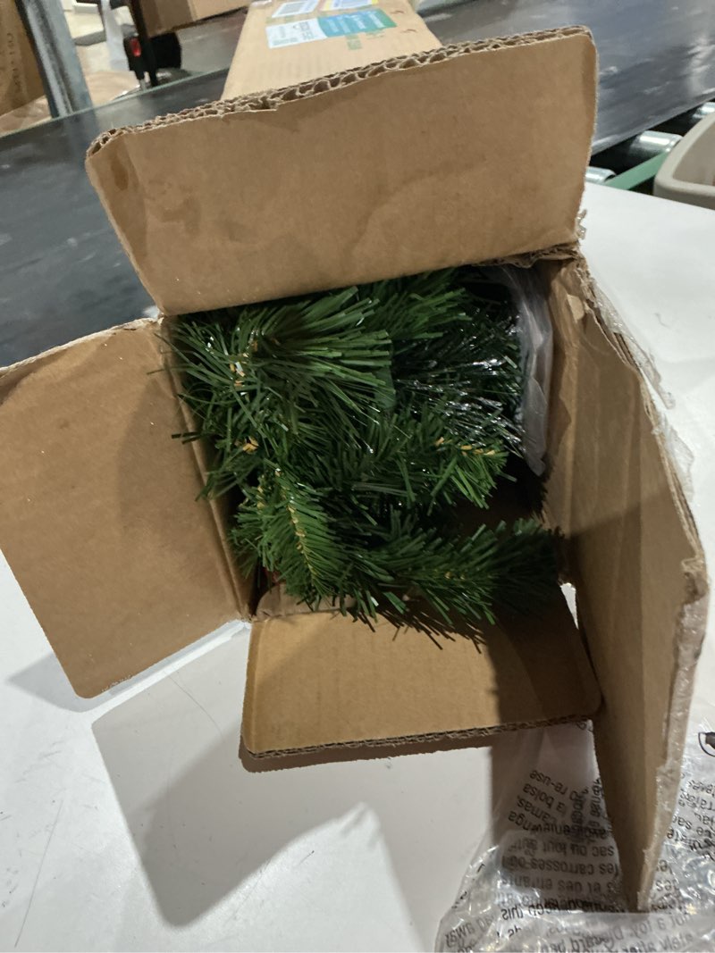 Condition photo showing Good Condition for national tree company 9 ft pre-lit crestwood spruce artificial christmas garland, christmas decoration with glitter, pinecones, red berries, 50 clear lights, 180 tips, green plug in tree