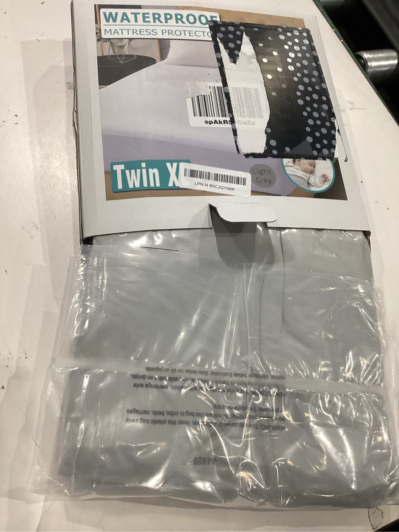 Condition photo showing New/Like New for twin xl waterproof mattress protector for dorms. noiseless, breathable, and machine washable fitted mattress cover with deep pocket up to 5”-21”?light grey? basic light grey twin xl 1