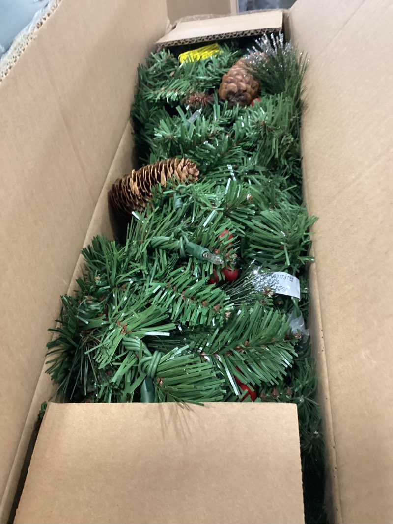 Condition photo showing New/Like New for National Tree Company 9 ft Pre-Lit Crestwood Spruce Artificial Christmas Garland, Christmas Decoration with Glitter, Pinecones, Red Berries, 50 Clear Lights, 180 Tips, Green Plug In Tree
