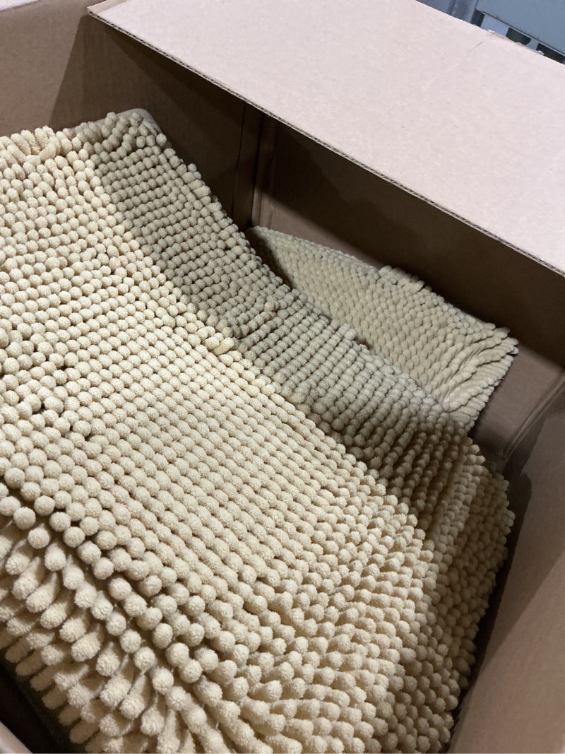 Condition photo showing As Is for madeals bath rug set 4 piece with toilet lid cover, soft shaggy bath rug set 3 piece and u-shaped toilet floor rug beige 20"x 32"/16"x 24"/contour/lid cover beige