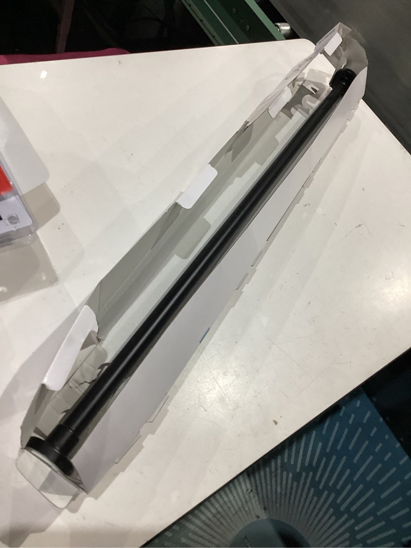 Condition photo showing As Is for origin 21 42-in to 72-in matte black tension single straight adjustable shower curtain rod