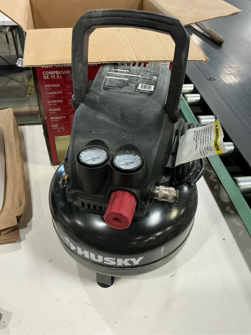 Condition photo showing As Is for  3 gal. 120 psi portable electric oil-free light duty pancake air compressor with fold down handle and 1-quick coupler