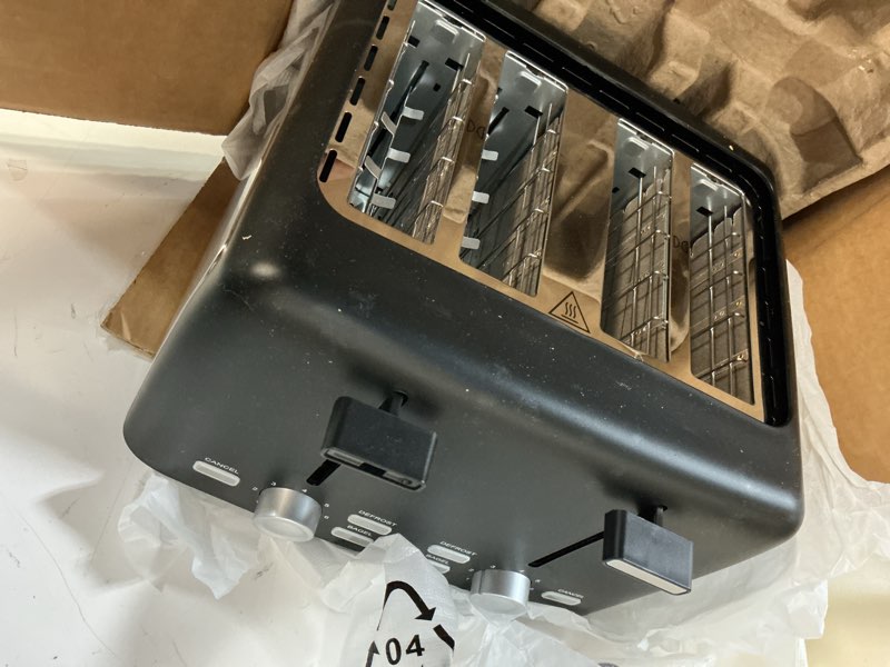 Condition photo showing Good Condition for amazon basics 4 slice toaster, with 7 browning settings, extra wide slots for bagels and special breads, removable easy-to-clean crumb trays, cancel/defrost/bagel buttons, 1500w, black & silver 4 slice matte black front