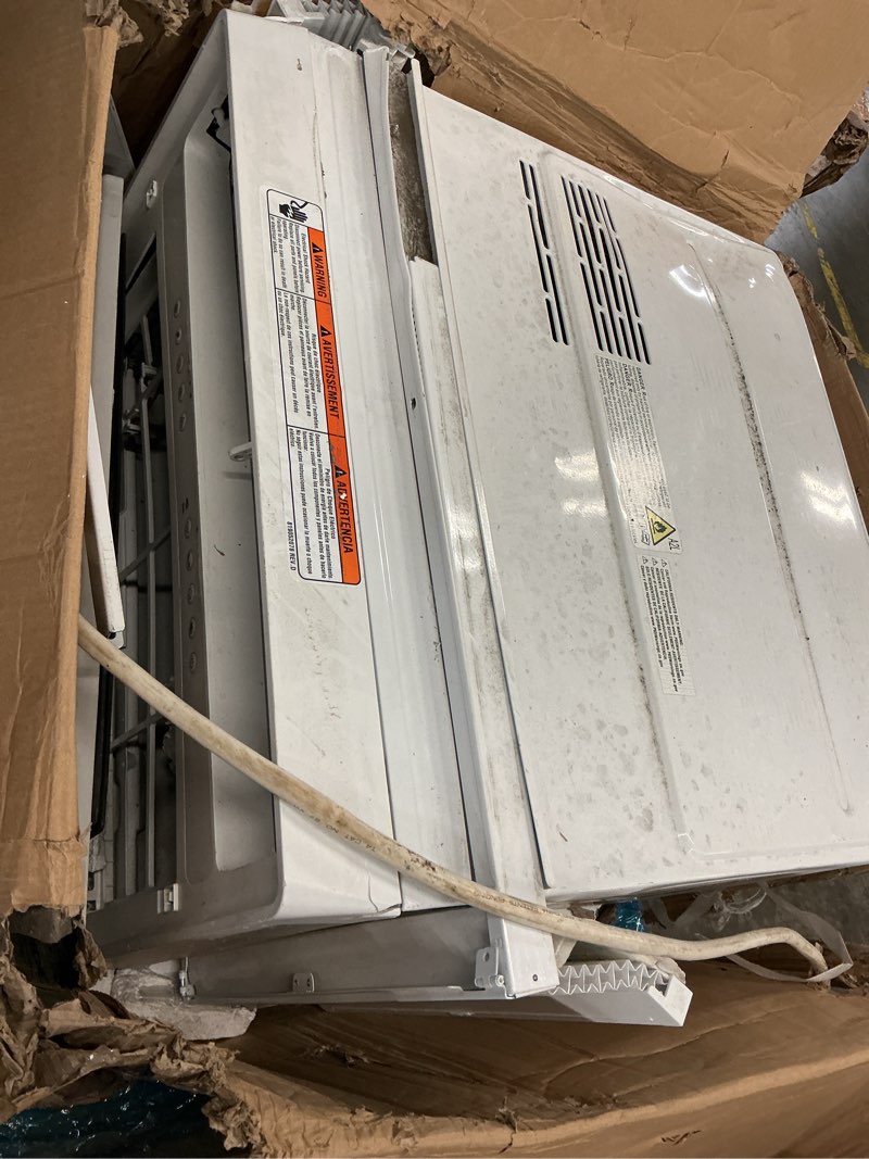 Condition photo showing As Is for 18,000 btu (doe) 230v window mounted inverter air conditioner cools 1,000 sq. ft. with dehumidifier and remote in white by whirlpool