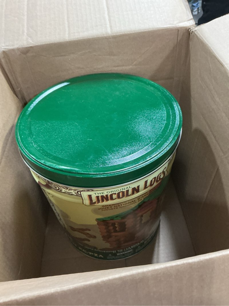 Condition photo showing As Is for Lincoln Logs 100th Anniversary Tin