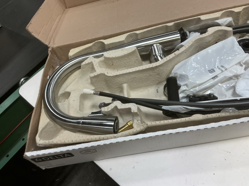 Condition photo showing New/Like New for delta essa touchless kitchen faucet with touch technology, brushed nickel kitchen sink faucet with pull down sprayer, single hole, arctic stainless 9113tl-ar-dst