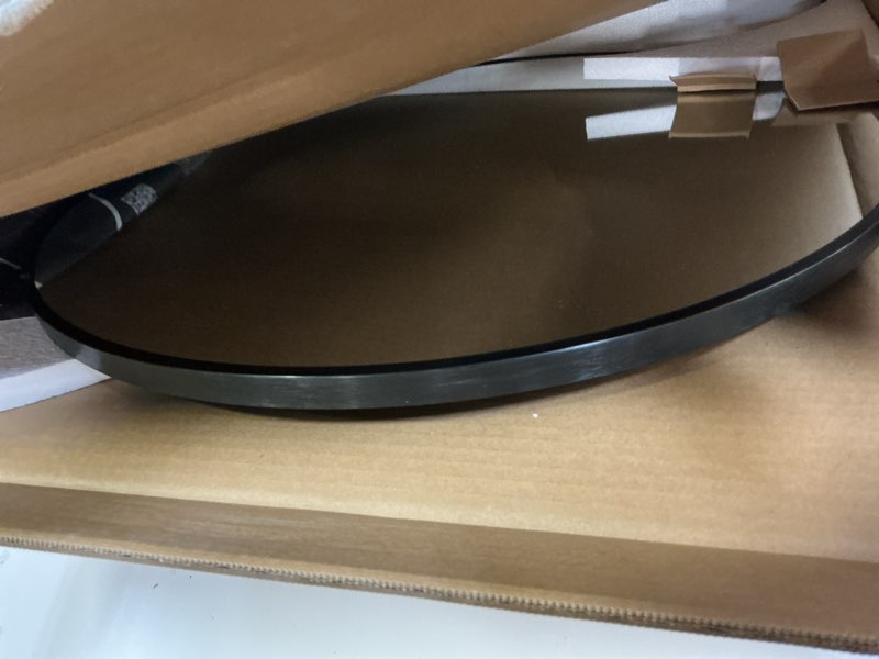 Condition photo showing Good Condition for black 24 in w x 24 in. h round metal framed wall mirror