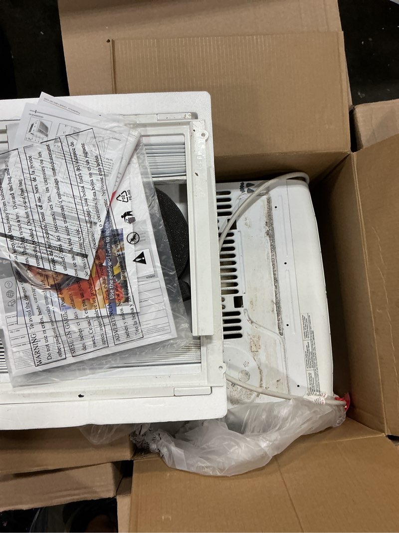 Condition photo showing As Is for frigidaire 5,000 btu window-mounted air conditioner, cools up to 150 sq. ft., quiet operation, effortless temperature control, 2 fan speeds, auto restart, white 5,000 btu mechanical controls
