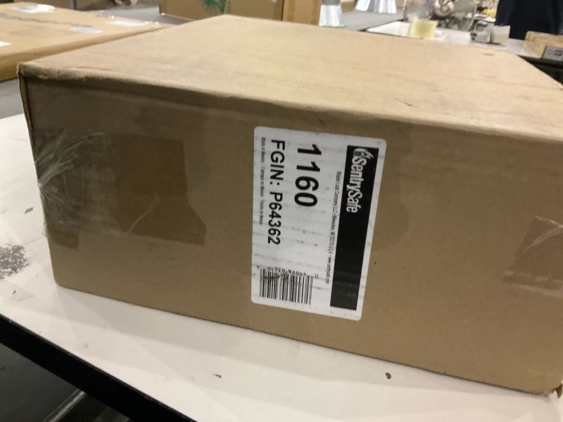 Condition photo showing New/Like New for SentrySafe Fireproof Safe Box with Key Lock, Chest Safe with Carrying Handle to Secure Money, Jewelry, Documents, 0.25 Cubic Feet, 6.3 x 15.3 x 12.1 Inches, 1160
