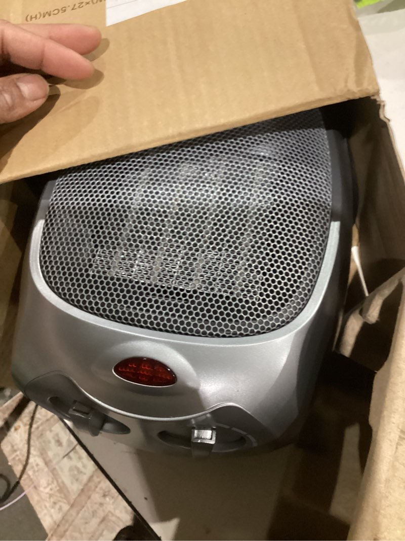 Condition photo showing As Is for Amazon Basics Ceramic Space Heater, Portable Indoor Heating Solution, With Overheat and Tip-Over Protection, Thermostat, Non-Oscillating, 1500W, 7.52"D x 6.34"W x 9.45"H, Silver Non-oscillating silver