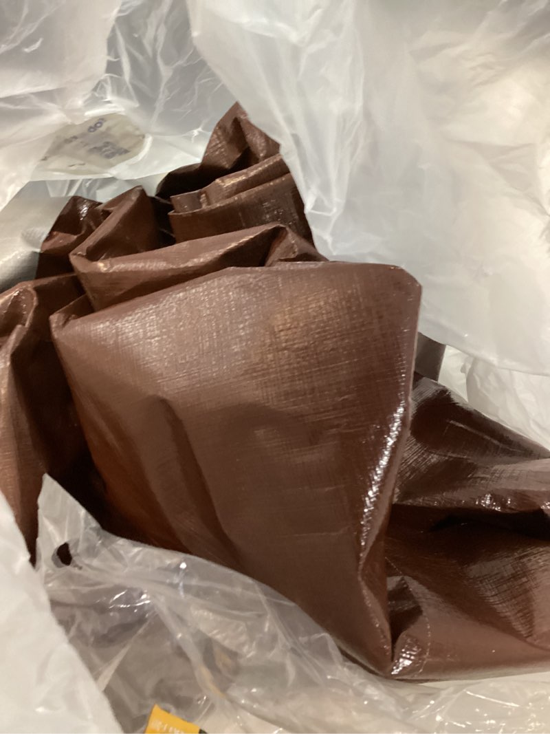 Condition photo showing As Is for ozark trail 9' x 12' heavy-duty weather resistant tarpaulin with reinforced corners and grommets