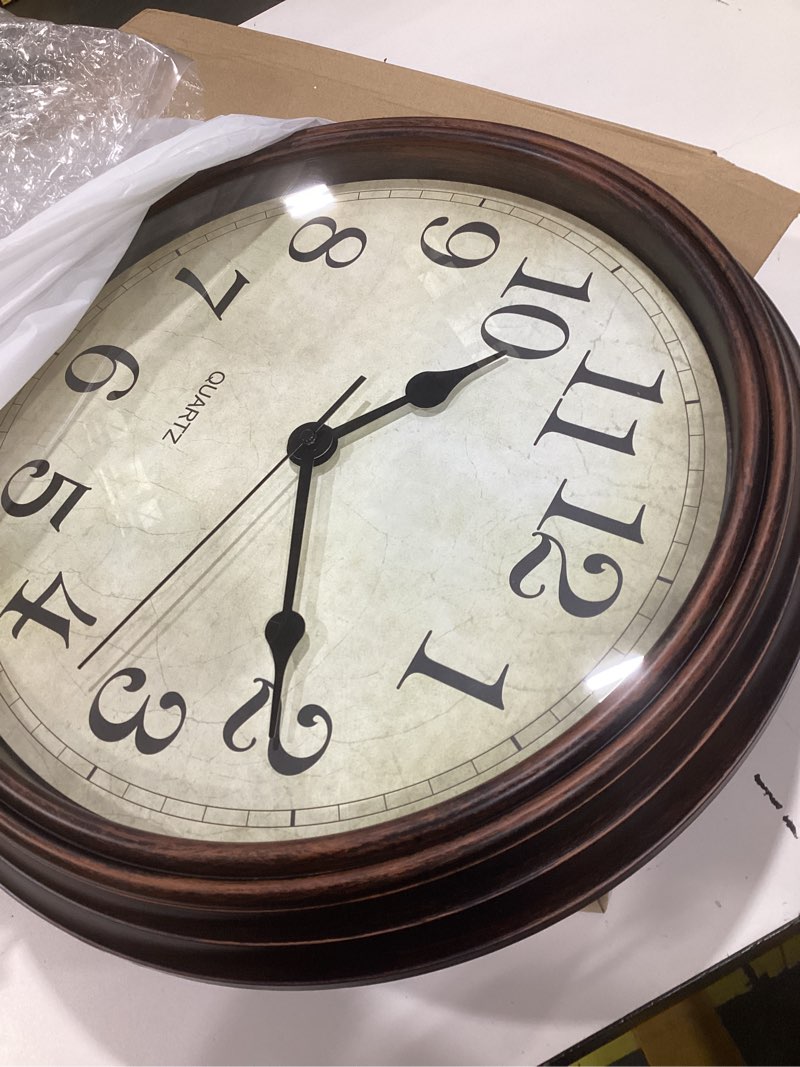 Condition photo showing As Is for hylanda wall clock, bronze silent non ticking classic battery operated clocks, decorative for living room, bedrooms, kitchen, office (16 inch) a_bronze 16"