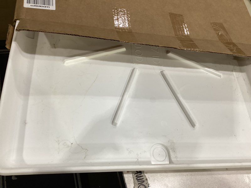 Condition photo showing Good Condition for camco stackable washing machine drain pan - measures 25? (l) x 27? (w) - great for apartment-sized washers or stackable units - protects floors from leaks - crafted of heavy-duty plastic (21006) pan ships in own container