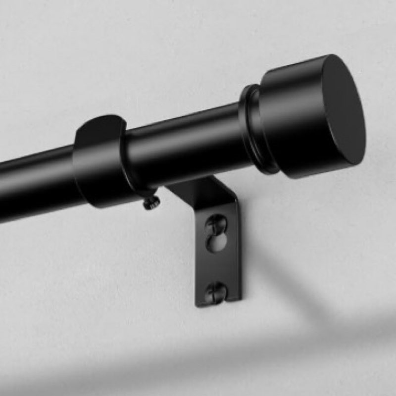 Black metal curtain rod with end caps (similar to stock photo) (unknown size)