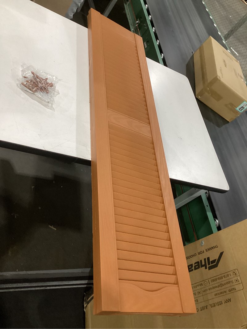 Condition photo showing Good Condition for 12"w x 52"h mid-america vinyl, standard size cathedral top center mullion, open louver shutter, w/installation shutter-lok's & matching screws (per pair), 471 - treated cedar 12-in. w x 52-in. h 471 - treated cedar