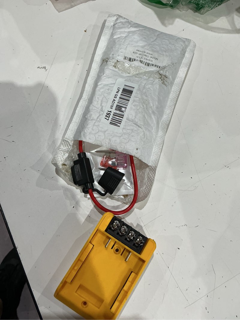 Condition photo showing As Is for low voltage protection power wheels battery adapter compatible for dewalt battery adapter 12v 20v 12v-30v with dc-dc 12v 2.5a lvp-30v-12vdc