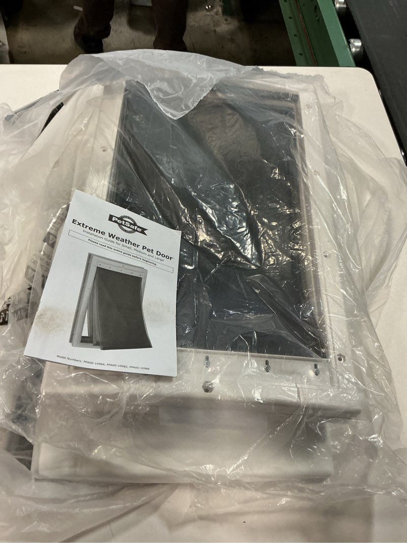 Condition photo showing As Is for PetSafe Extreme Weather Aluminum Pet Door - Energy-Saving Thermal Barrier Pet Flap with Slide-in Door Locking & Secure Flap Cover - for Dogs Up to 220 Lb - Extra Large Aluminum Pet Door X-Large (Pack of 1)