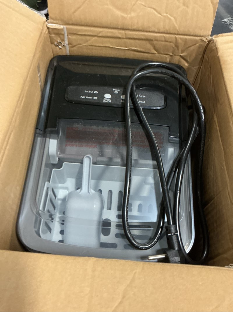 Condition photo showing As Is for Frigidaire 26 Lbs per Day Portable Compact Maker, Ice Making Machine, Black Stainless, Medium