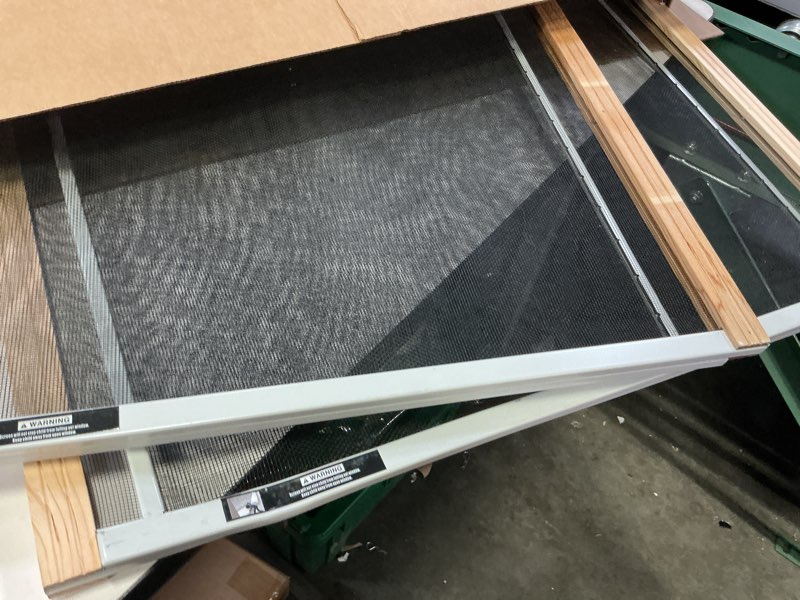 Condition photo showing As Is for frost king 2aws1845 wb marvin adjustable window screen, 18in high x fits 25-45in wide (2 pack) 18" high x fits 25-45" wide (2 pack)