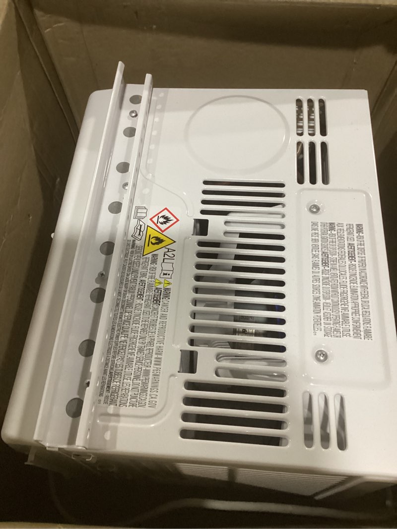 Condition photo showing As Is for amazon basics 5000-btu window air conditioner with quiet operation, up to 150 sqf, cool and fan functions, washable filter, adjustable window kit, intuitive mechanical controls, for small room, white white 5000 btu
