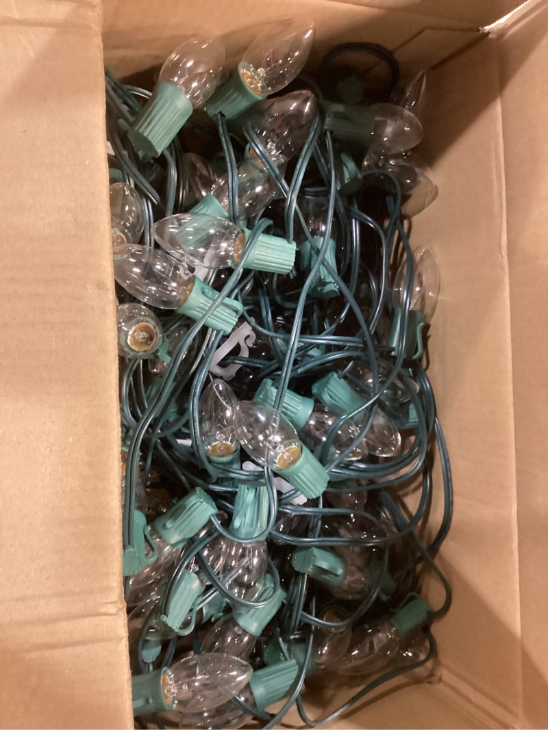 Condition photo showing As Is for C9 Clear Christmas String Lights, 100 Feet Waterproof Vintage Christmas Tree Lights, Outdoor Roofline String Lights with 100 Clear Bulbs for Patio Garden Holiday Indoor Home Decoration, Green Wire 100FT Clear Bulb Green Wire