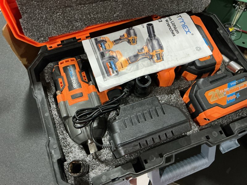 Condition photo showing Good Condition for cordless impact wrench, 900ft-lbs (1200n.m) 1/2" brushless impact gun, 21v high torque power impact driver, 2x4.0ah batteries electric impact motor variable speeds for car/pickup truck/mower orange