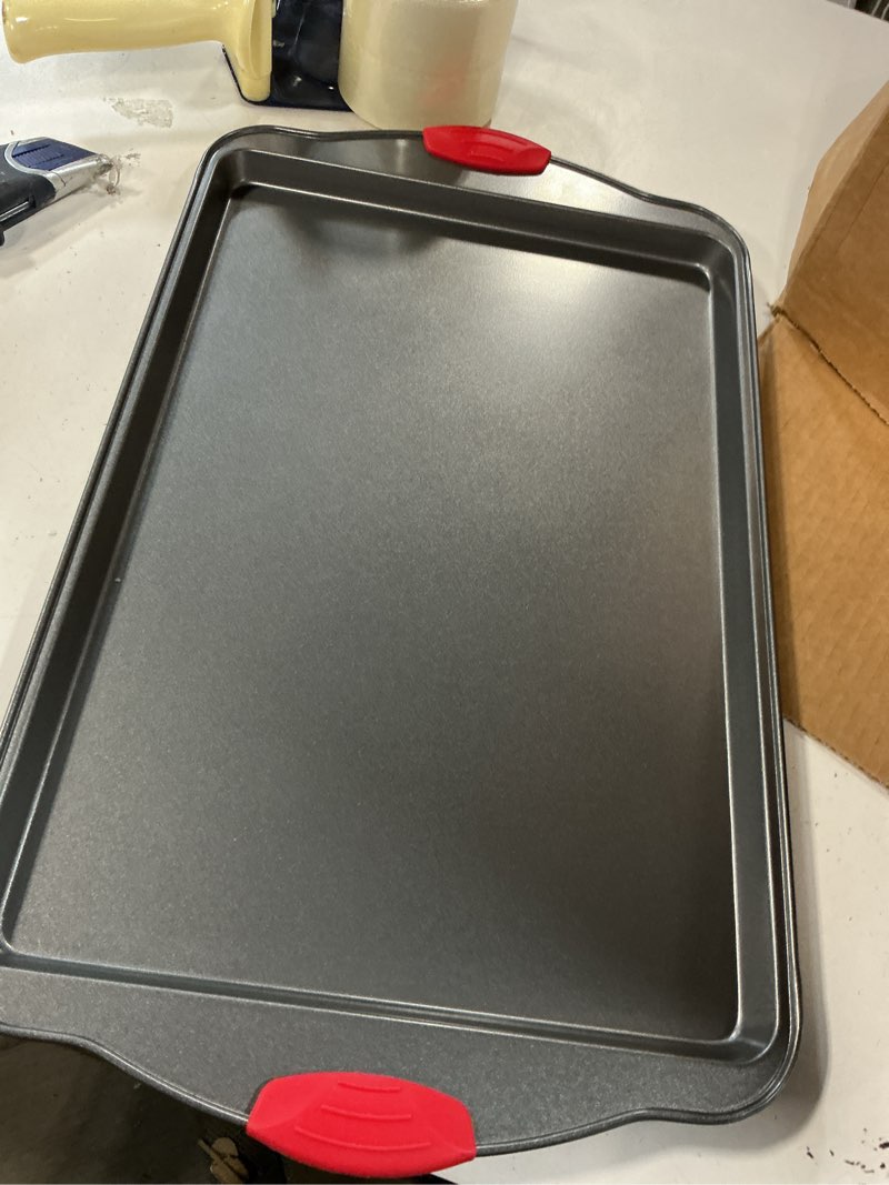 Condition photo showing As Is for Boxiki Kitchen Non-Stick Baking & Cookie Sheet Pan Non-Toxic 11x14 Inch Rimmed Carbon Steel Baking Sheet. Dent, Warp and Rust Resistant. Heavy Gauge Steel Oven Baking Sheet. 1 Tray. 1 Pc Carbon Steel