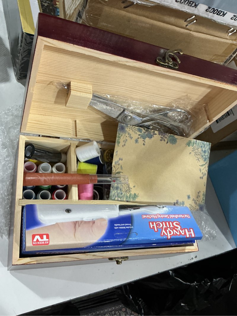 Condition photo showing New/Like New for hand held sewing machine, with red wooden sewing box and 143 pcs sewing kit, mini portable handheld sewing machine for adults and beginners, with a power adapter and heavy-duty scissors white