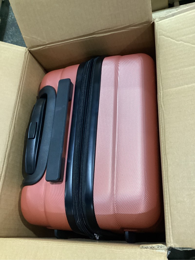 Condition photo showing As Is for amazon basics 21" hardside carry-on luggage with multi-directional wheels, expandable for up to 25% more space, scratch-resistant surface, rose gold rose gold carry-on
