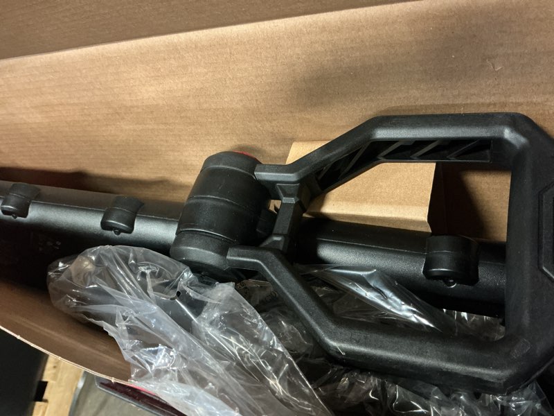 Condition photo showing As Is for hyper tough 12" 20v brushless cordless string trimmer with 20v max 2.0ah battery and charging cable