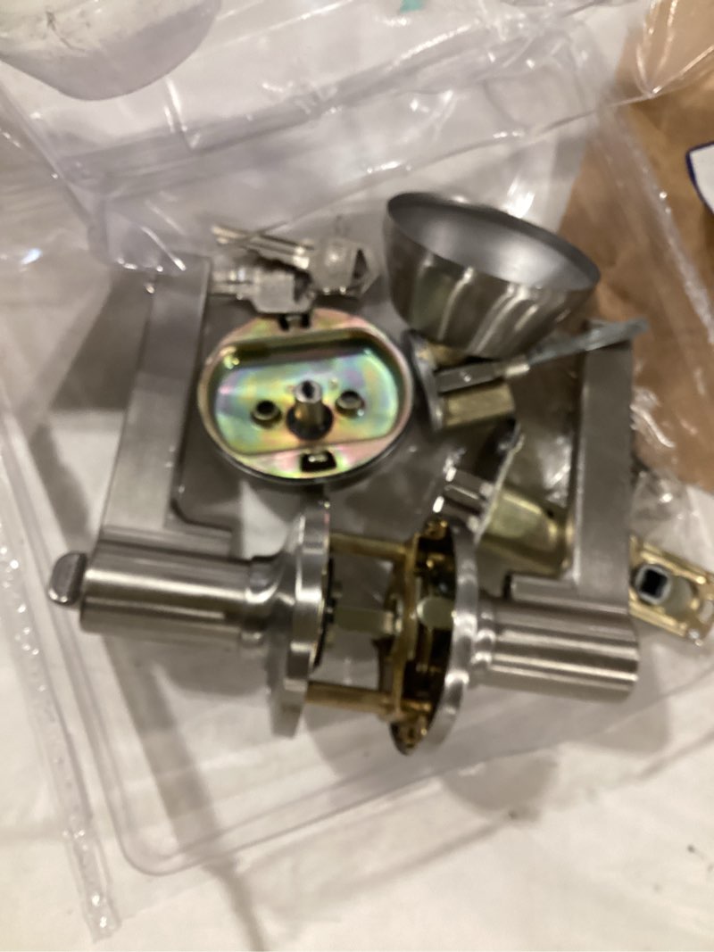Condition photo showing As Is for berlin modisch passage lever door handle [non-locking lever set] for hallway doors or closets with a satin nickel finish, reversible for right & left side, classic series