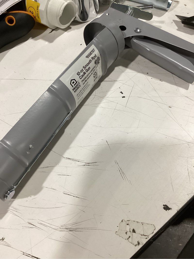 Condition photo showing As Is for project source 10 -oz smooth rod caulk gun