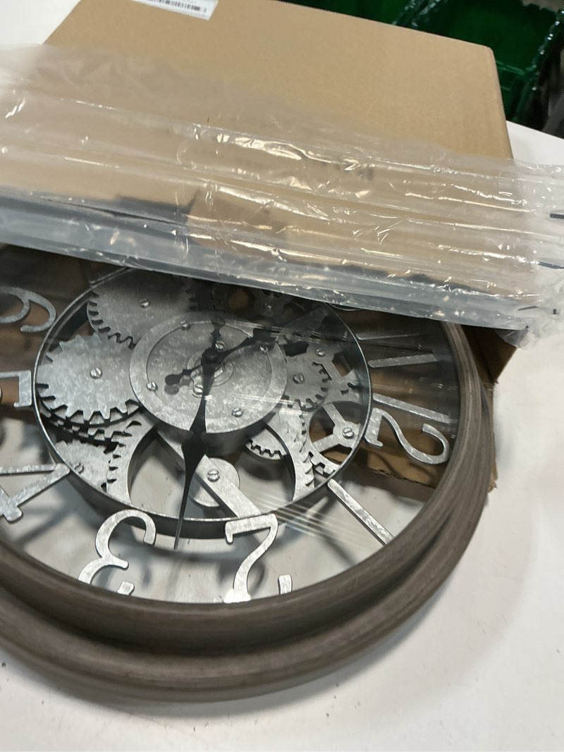 Condition photo showing Good Condition for presentime & co 12" farmhouse gear clock, silent no ticking, indoor/outdoor clock, weatherproof, grey oak and galvanized finish. wall décor/outdoor décor for living room, kitchen, garden, and patio.