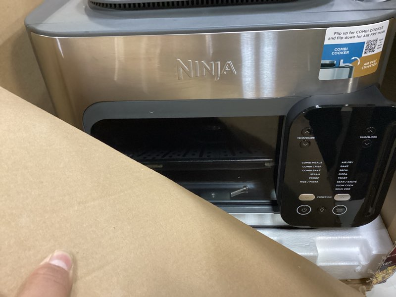 Condition photo showing Good Condition for ninja combi all-in-one multicooker, oven, & air fryer, complete meals in 15 mins, 14-in-1 functions, combi cooker + air fry, bake, roast, slow cook and more, 3 accessories, stainless steel, sfp701