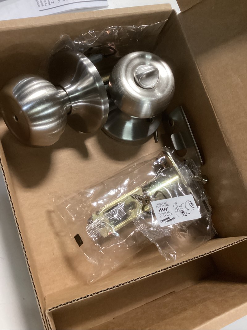 Condition photo showing As Is for Amazon Basics Bedroom/Bathroom Door Knob With Lock, Coastal, 1-3/8” to 1-3/4”, Satin Nickel