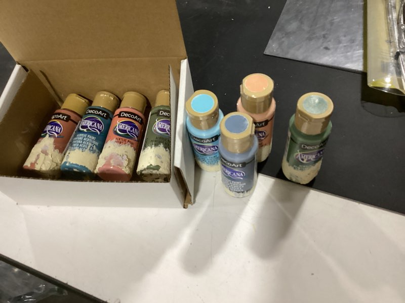 Condition photo showing As Is for (8 of 9) decoart americana acrylic paint set – essential pastel colors, 9 bottles (2 fl oz) – art and craft acrylic paints for canvas, wood, and more multi - pastel essentials 2 fl oz (pack of 9)