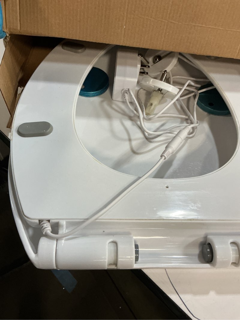Condition photo showing As Is for Extended heating toilet seat with slow-close hinge, designed to never loosen and easy to disassemble for convenient cleaning. Made of plastic, white (17.72 inches long x 14.37 inches wide)