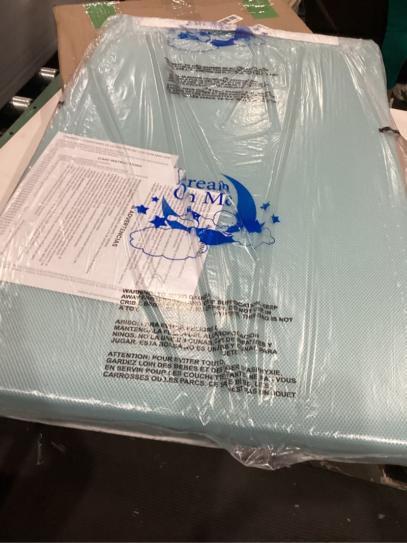 Condition photo showing New/Like New for dream on me snuggles extra firm dual-sided baby crib mattress with breathable fabric, water & odor resistant, greenguard gold certified, fits mini & portable cribs (38”x 24”x 3”) - blue mist
