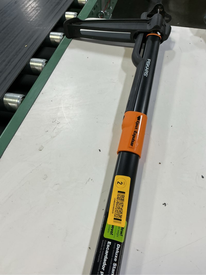 Condition photo showing As Is for fiskars 34 in. stand up 4 claw long handle weed puller tool; heavy duty garden, lawn and dandelion weeder, easy-eject no bending