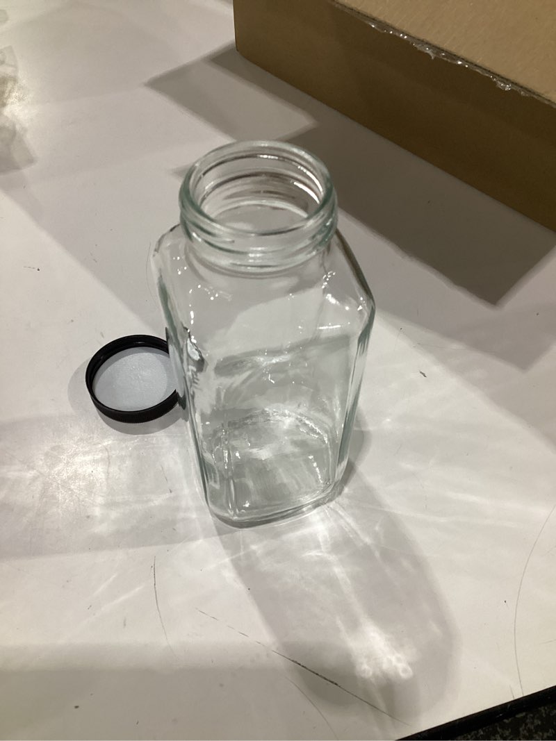 Condition photo showing Good Condition for EkkoVla 12 Pack 16 oz Glass Juice Bottles with Lids, Reusable Empty Drinking Jars Juice Containers Water Cups with Brush Labels for Juicing, Smoothies, Water, Milk, Kombucha Storage 16 FL.OZ