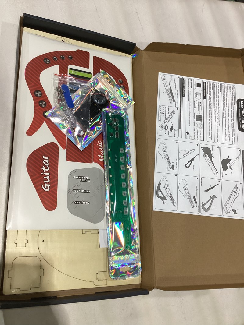 Condition photo showing New/Like New for SkilLify Guitar Toy for Kids, 3-in-1 Musical Instrument Toy, Keyboard Piano & Bass Sounds, DIY Electronic Wooden Play Guitar Kit for 5-12 Year Old Children Boys Girls Gifts(Red)